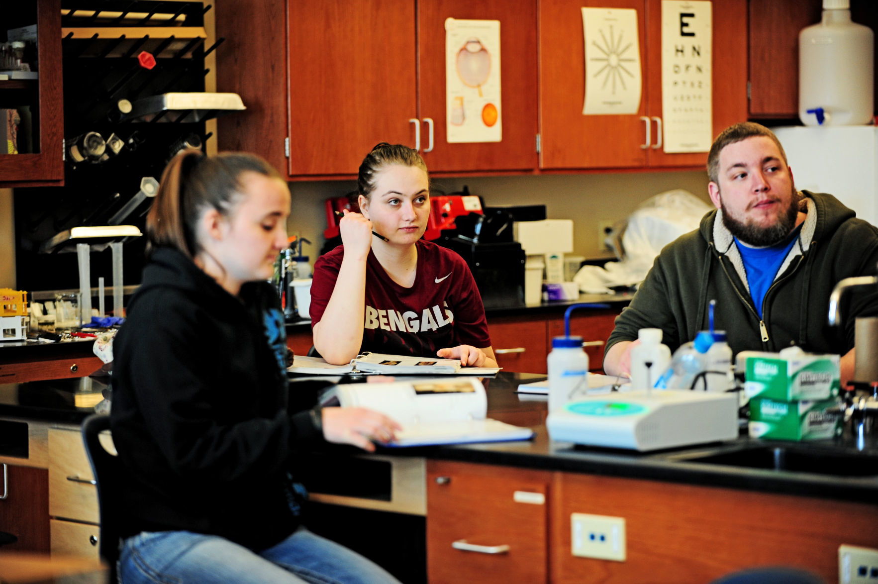 Students takes notes in a biology class at Helena College.